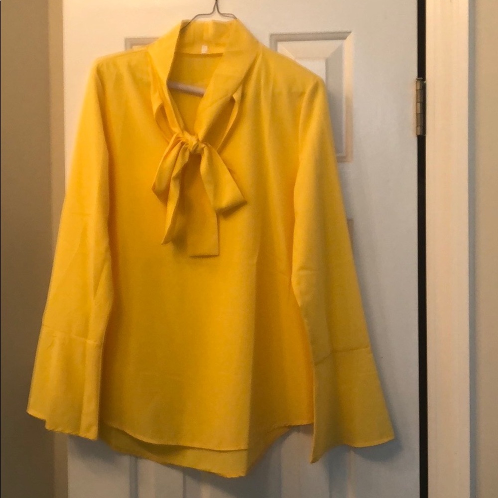 Yellow gold bell-sleeved blouse with v-neck